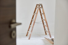 Wooden Ladder In Room With Painting Work When Building A House