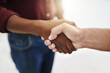 © D Donson/peopleimages.com - Closeup handshake showing success, support and trust between collaborating businessmen. Fingers of creative office business colleagues making a deal and agreeing or welcoming, greeting and promoting