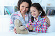 © aletia2011 - Mother with her little daughter playing nurse