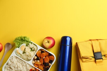 Sticker - Flat lay composition with thermos and food on yellow background. Space for text