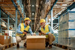 © ivanko80 - Warehouse workers scanning box