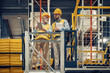 © ivanko80 - Two employees with tablet at logistics center warehouse