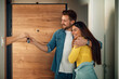 © ivanko80 - Lovely couple holding keys from their new home