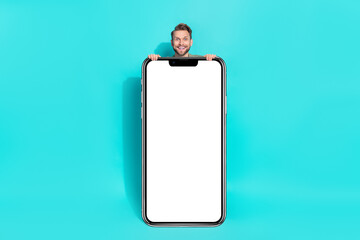 Poster - Photo of excited funky positive man sale reaction placard empty space wear pullover isolated blue color background