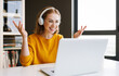© JenkoAtaman - Positive young businesswoman speaking to online colleagues
