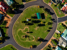 Park And Playground In The Center Of Streets And Homes Seen From The Air