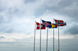 Scandinavian flags fluttering in the sky reminds of the historical Kalmar union between Sweden, Denmark, Iceland, Faroe Islands, Greenland and Norway against the Hanseatic League economical influence