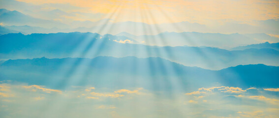 Wall Mural - mountains in fog sunset panorama landscape with sunset sky