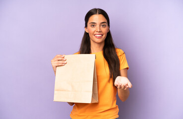 Wall Mural - pretty hispanic woman smiling happily with friendly and  offering and showing a concept. take away coffee concept