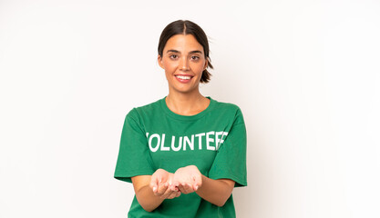 Wall Mural - pretty hispanic woman smiling happily with friendly and  offering and showing a concept. ecology and volunteer concept