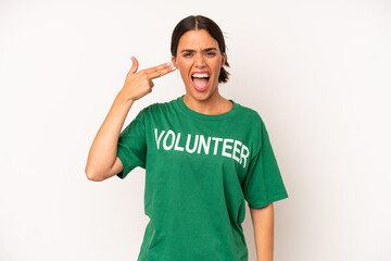 Wall Mural - pretty hispanic woman looking unhappy and stressed, suicide gesture making gun sign. ecology and volunteer concept