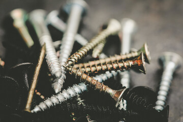 Different Kind of Screws on a table in a workshop