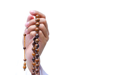 Wall Mural - Religious muslim islam man in white session lift hand for praying and wearing bead on hand to determine the number of prayer services.concept for Ramadan, Eid al Fitr, eid ad-ha, meditation, praying