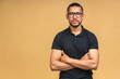 © denis_vermenko - Portrait of a serious young african american black business man standing isolated over beige background.