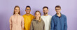 © Studio Romantic - Portrait of group of young, smart and positive multiracial people on purple background. International students who are dressed in casual clothes and smiling confidently looking at camera. Banner.