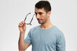 © SHOTPRIME STUDIO - man in blue t-shirt glasses for vision smile emotions cropped view