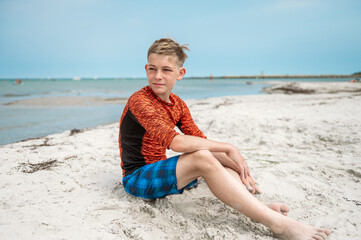 Portrait of handsom teen boy on beautiful beach at summer holidays