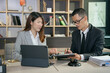 © aekachai - Asian business Lawyers having  Concepts of  Legal services at the law office work Legal advice online