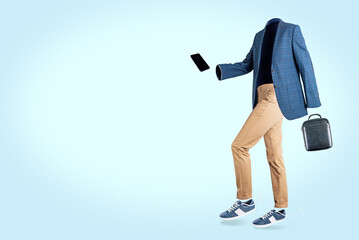 Wall Mural - Blue jacket, beige trousers and blue sneakers on a blue background