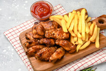 Lunch Fast Food Chicken Wings With Ketchup And Potatoes Fries