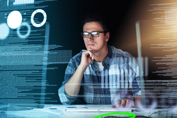 Fototapete - Male IT computer engineer working on a futuristic hologram or cgi screen at his office desk. Tech designer working on technology to test new and innovative data. Web developer work on a digital code