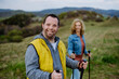 © Halfpoint - Portrait of happy young man with Down syndrome with his mother hiking together in nature.