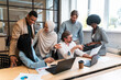 © oneinchpunch - start up business team in the office. Multiethnic group working together on a new project in the conference room