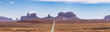 Scenic Road in the Dry Desert with Red Rocky Mountains in Background. Forrest Gump Point in Oljato-Monument Valley, Utah, United States. Panorama