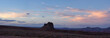 Red Rock Mountain Landscape during colorful sunset sky. Alhambra Rock near Mexican Hat, Utah, United States. American Nature Background Panorama