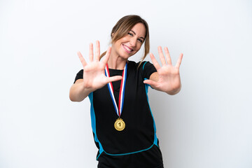 Wall Mural - Young caucasian woman with medals isolated on white background counting ten with fingers