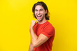 © luismolinero - Caucasian handsome man isolated on yellow background celebrating a victory