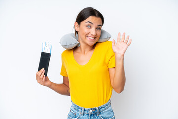 Poster - Woman with Inflatable Travel Pillow over isolated background saluting with hand with happy expression