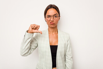 Wall Mural - Young hispanic woman isolated on white background showing a dislike gesture, thumbs down. Disagreement concept.