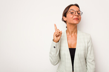 Wall Mural - Young hispanic woman isolated on white background showing number one with finger.