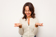 © Asier - Young hispanic woman isolated on white background holding something with palms, offering to camera.