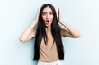 © Asier - Young caucasian woman isolated on blue background surprised and shocked.