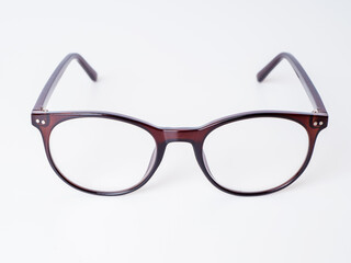 Corrective glasses in a brown plastic frame