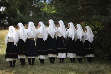 People in traditional folk costume of The National Folklore Fair in Koprivshtica. The National Folklore Fair in Koprivshtica is entered in the UNESCO Register of the human intangible cultural heritage