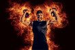 © zamuruev - Handsome bearded tattooed bodybuilder workout wih kettlebell. Fire art concept