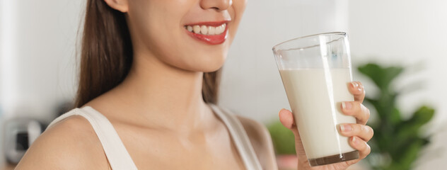 Close up person drinking a glass of milk