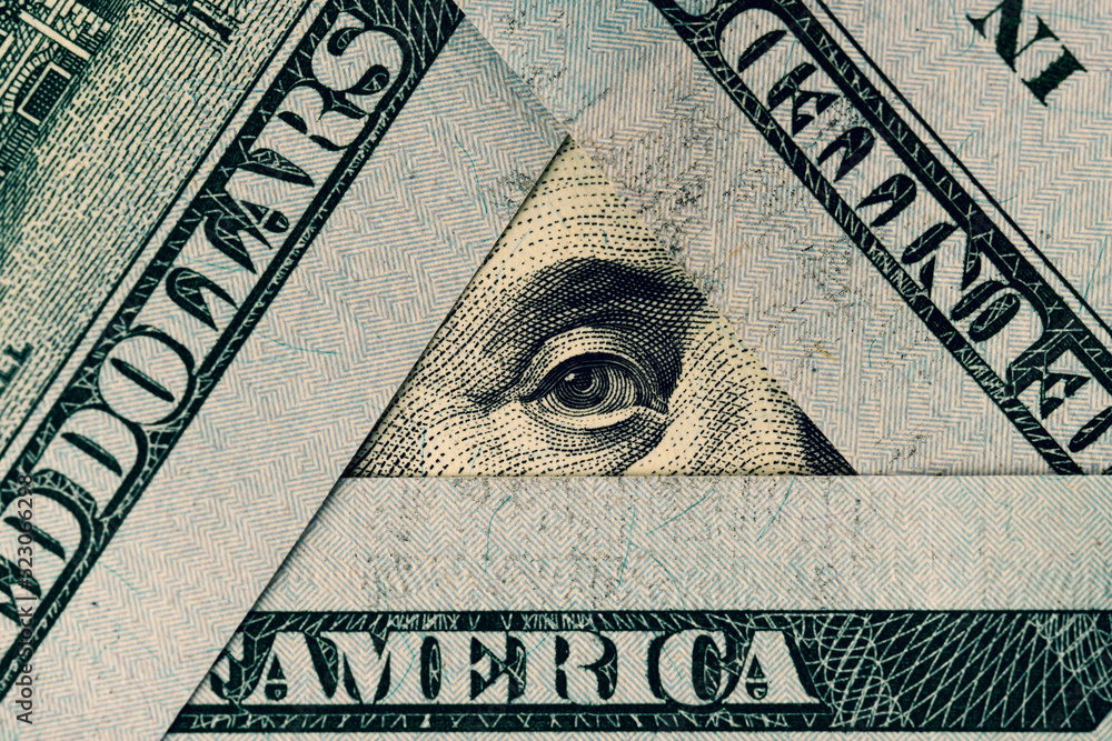 President Franklin's eye in a triangle of hundred dollar bills. Words ...
