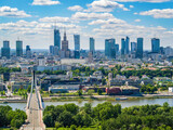 Fototapeta Do pokoju - Swietokrzyski bridge and skyscrapers in city center, Warsaw aerial landscape under blue sky