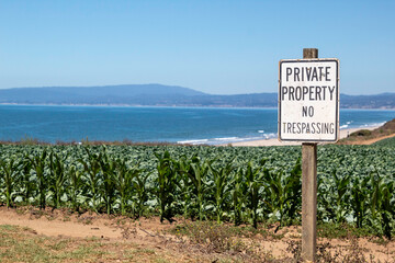 Private Property no trespassing sign on farm land