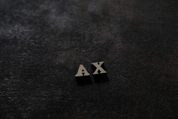 Wall Mural - The letters A and X above the dark field. Initials AX