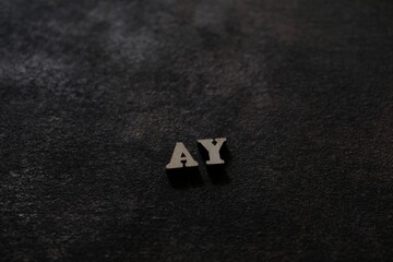 Wall Mural - The letters A and Y above the dark field. Initials AY