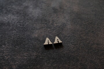 Wall Mural - The letters A and A above the dark field. Initials AA