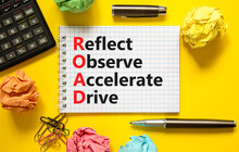 ROAD Reflect Observe Accelerate Drive Symbol. Concept Words ROAD Reflect Observe Accelerate Drive On White Note, Yellow Background. Business ROAD Reflect Observe Accelerate Drive Concept. Copy Space.