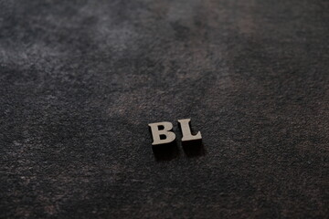 Wall Mural - the letters b and l above the dark field. initials bl