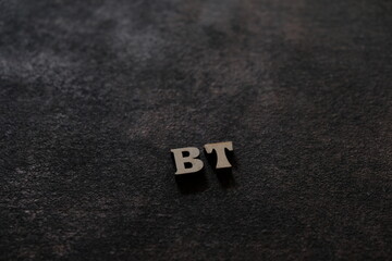 Wall Mural - the letters b and t above the dark field. initials bt