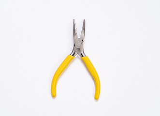 Yellow plier on white background